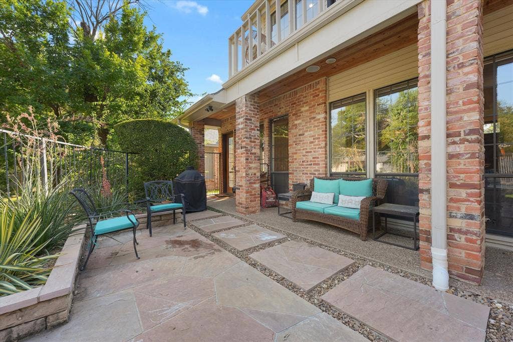 1312 Chippewa Drive, Plano, TX 75093 Covered rear patio with a reclaimed-pine ceiling and space to relax outdoors.
