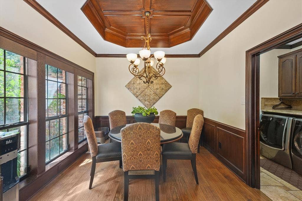 1312 Chippewa Drive, Plano, TX 75093 Breakfast area with a wood-paneled ceiling and windows overlooking the front patio.