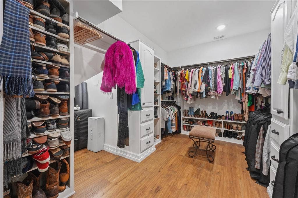 1312 Chippewa Drive, Plano, TX 75093 Expanded primary walk-in closet with custom storage.