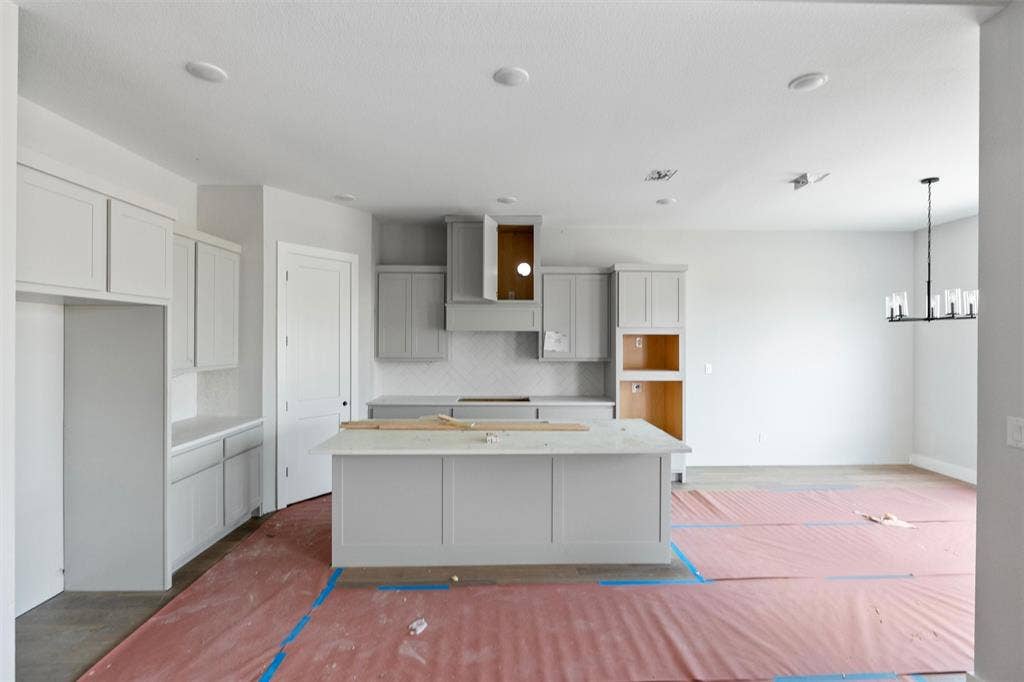 1312 Tahonta Drive, Hewitt, TX 76643 Kitchen featuring a central island with countertop, light gray cabinetry, recessed lighting, and a chandelier