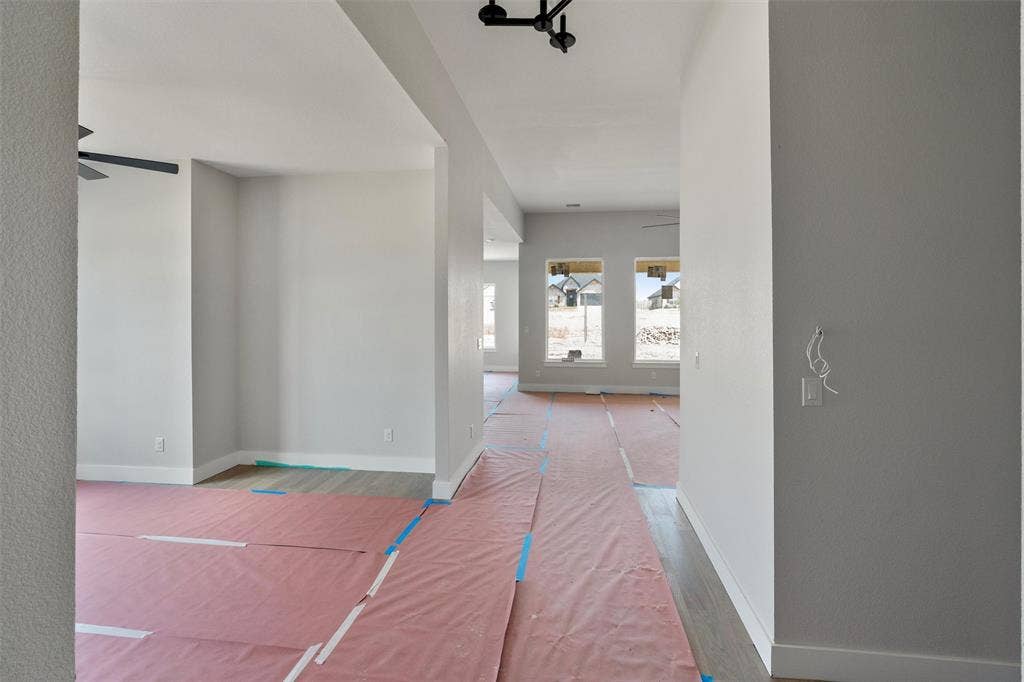 1312 Tahonta Drive, Hewitt, TX 76643 Recessed ceiling, wood-finish flooring, white baseboards, ample natural light, contemporary ceiling fan