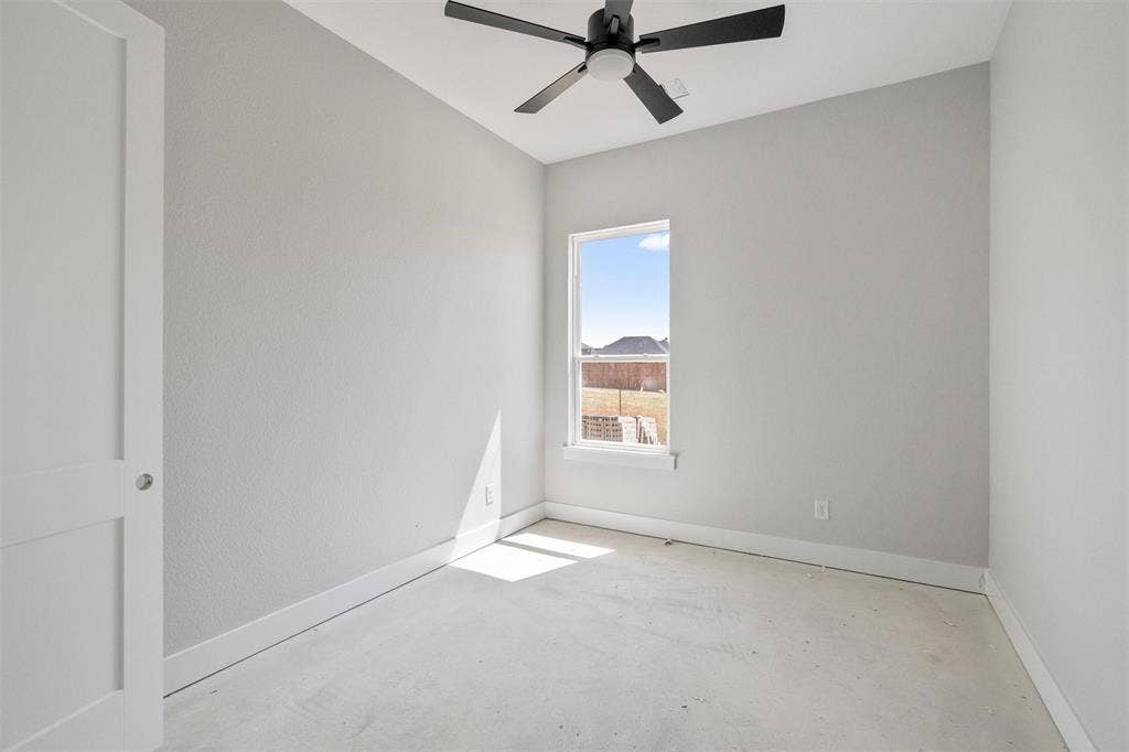 1312 Tahonta Drive, Hewitt, TX 76643 Recessed window, ceiling fan, solid interior door, light-toned walls, and white trim