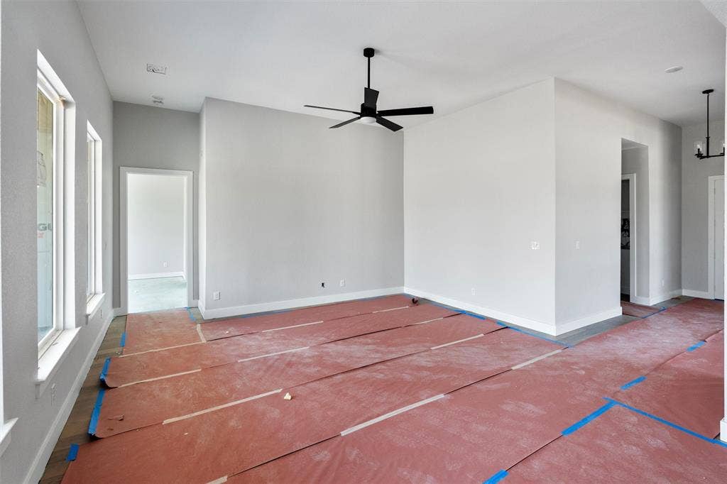 1312 Tahonta Drive, Hewitt, TX 76643 Vaulted ceiling, multiple windows, recessed lighting, contemporary ceiling fan, and modern wall sconce