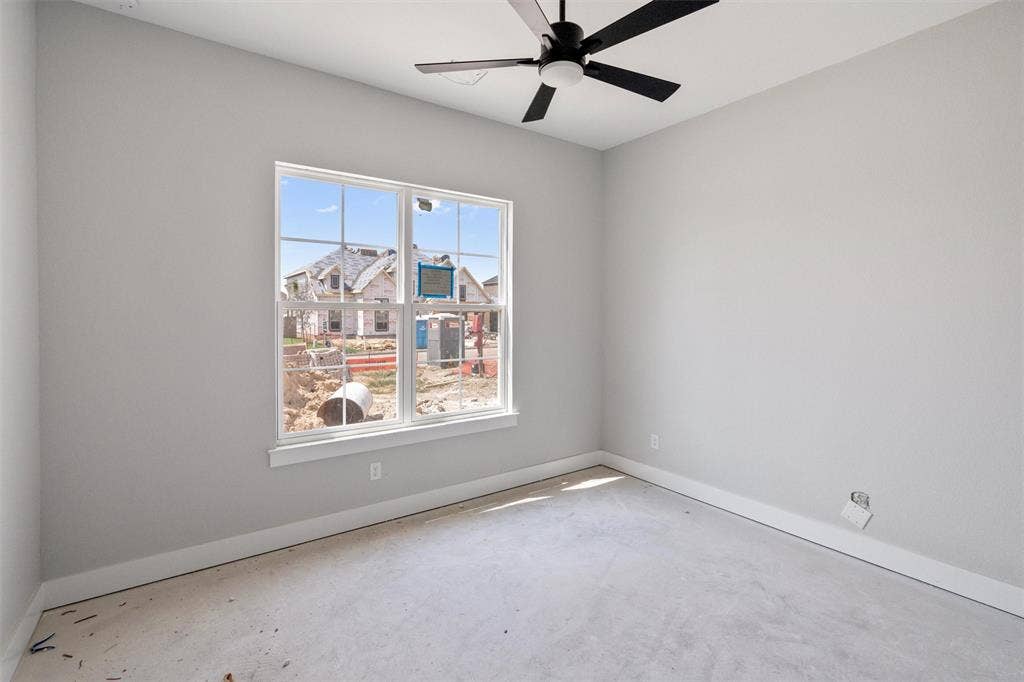 1312 Tahonta Drive, Hewitt, TX 76643 White interior walls with a white-trimmed window