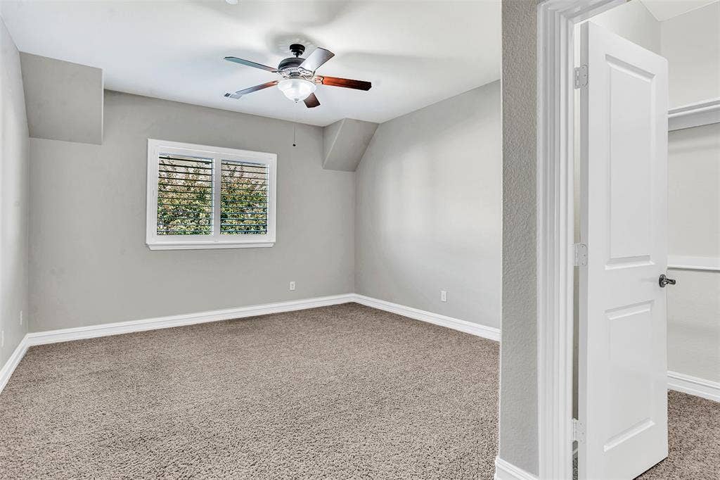 4817 BAYVIEW Drive, Plano, TX 75093 Bedroom 3 has a large window with Plantation shutters overlooking the backyard and also has a large walk-in closet.