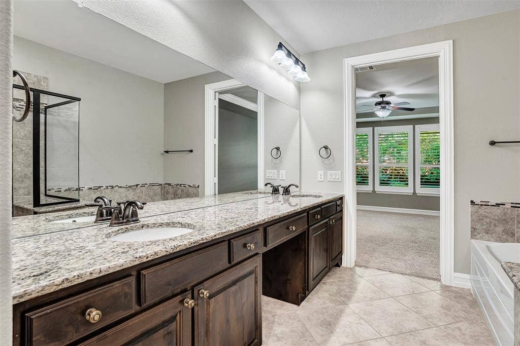 4817 BAYVIEW Drive, Plano, TX 75093 The massive vanity means you will have plenty of room for more than one person to get ready for work in the morning, or an evening out. A make up area has room for a chair!