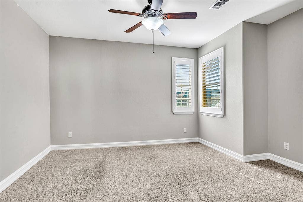 4817 BAYVIEW Drive, Plano, TX 75093 Bedroom 2 has Plantation shutters on the windows and a large walk-in closet.