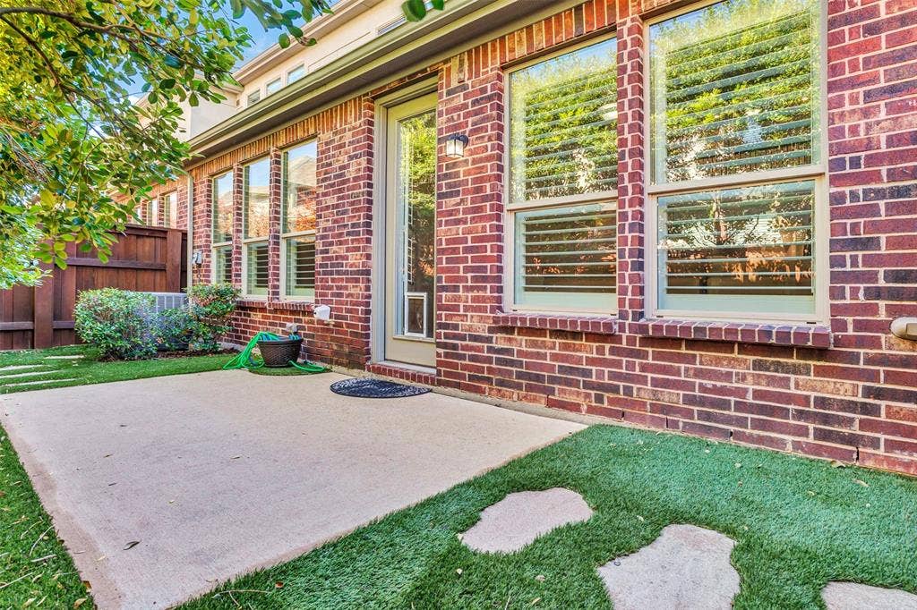 4817 BAYVIEW Drive, Plano, TX 75093 Lovely patio has large stepping stone that take you to the side of the house. You can really appreciate all the windows in the home that keep it so bright inside!