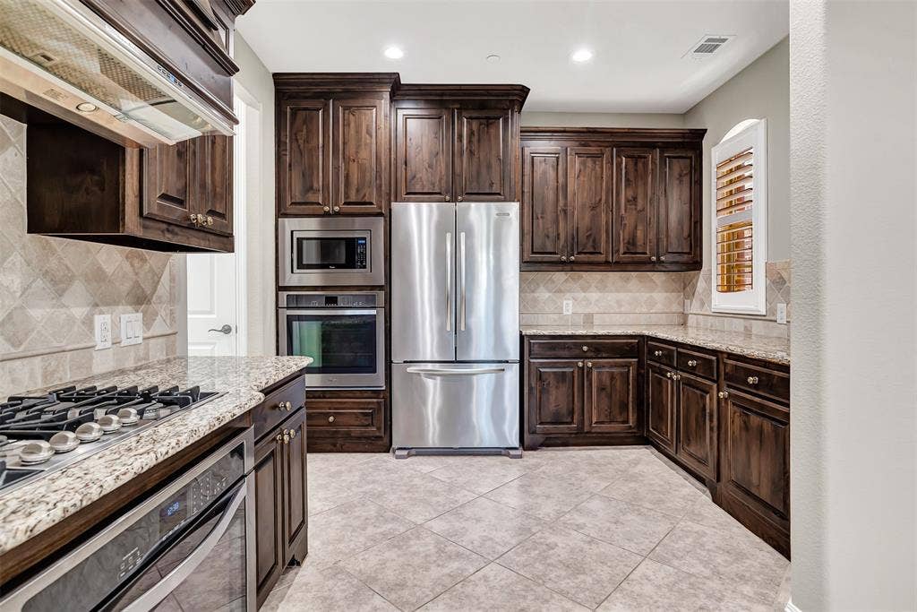 4817 BAYVIEW Drive, Plano, TX 75093 Just look at all this counter and cabinet space, it goes on for miles! Food prep and cooking will be a breeze.