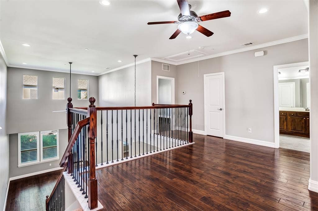 4817 BAYVIEW Drive, Plano, TX 75093 This lovely area has so many uses! Great for a home office, a quiet reading nook, meditation, yoga, arts and crafts...the wrought iron balusters provide light from the large windows in the family room and keep the rooms open and airy.