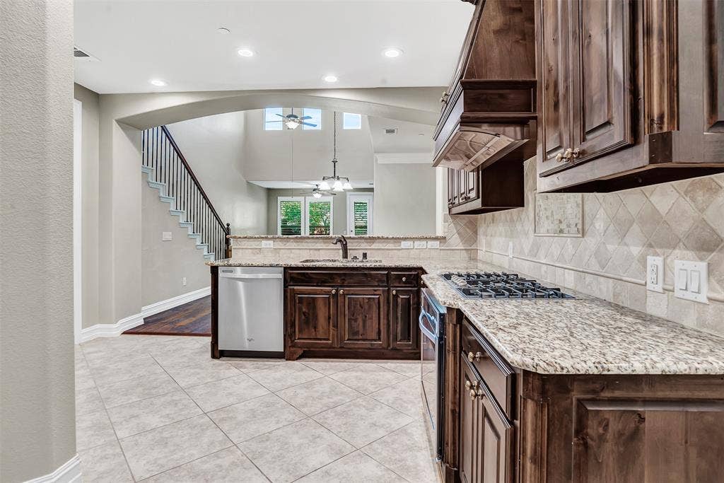4817 BAYVIEW Drive, Plano, TX 75093 Gorgeous kitchen looks to the dining area and living room with the glorious open floor plan