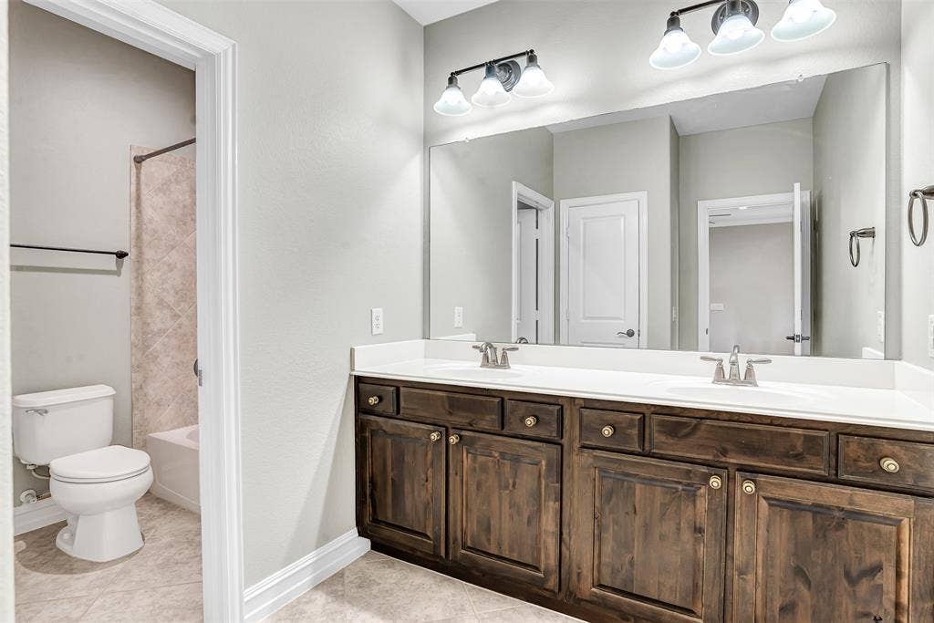 4817 BAYVIEW Drive, Plano, TX 75093 The full bath upstairs has a large vanity with dual sinks and a separate tub/shower area so more than one person can be using the bath at the same time, each with privacy!