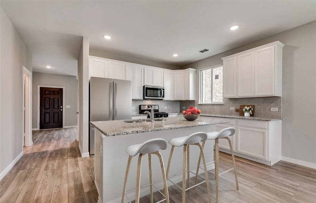 3417 Majesty Lane, Denton, TX 76208 *Virtual Representation - Spacious kitchen with eat-in bartop island