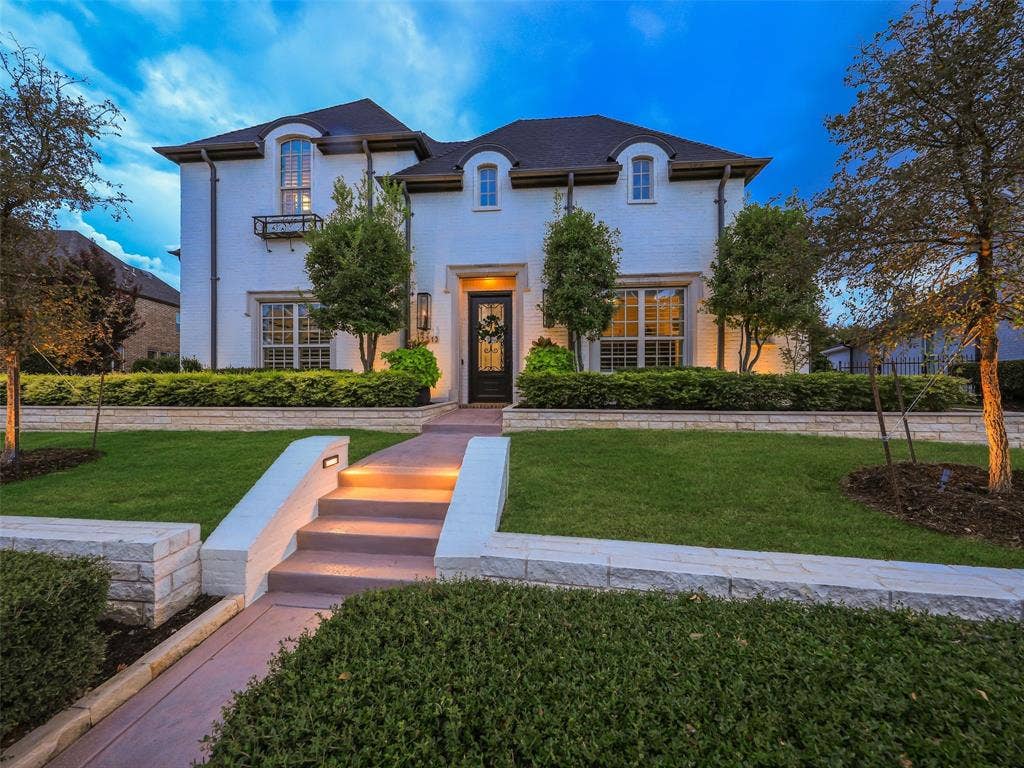 12313 Winding Hollow Lane, Frisco, TX 75033 Discover an extraordinary 4,968 sqft of luxury living in the prestigious Newman Village community of Frisco, Texas. Thoughtfully designed with an impressive collection of custom finishes, designer upgrades, sophisticated living spaces, and resort-inspired outdoor amenities, this exceptional residence offers the ideal combination of timeless elegance, modern convenience, and effortless entertaining. From the dramatic architecture and wide-plank white oak flooring to the spectacular custom pool, spa, and outdoor living center, nearly every detail has been carefully selected to create a home that is as beautiful as it is functional.