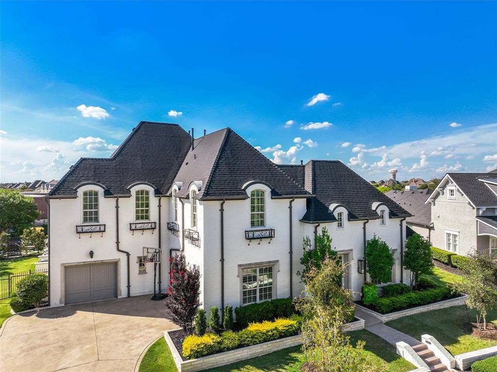 12313 Winding Hollow Lane, Frisco, TX 75033 Total 4,968 sqft of living space. Garage 1,014 sqft. The exterior has continued to receive thoughtful improvements, including stone flower-bed retaining walls installed in the front yard in 2025 and a Rain Bird sprinkler system added in 2026. These enhancements complement the landscaping while providing convenience for maintaining the property. A new Dynasty IKO Class 3 impact-resistant shingle roof was installed in 2026. The home also features a Navien NPE-240A2 natural-gas tankless water heater installed in 2022 and a LiftMaster 1200 Series Wi-Fi-ready garage door operating system installed in 2025. Interior and exterior paint updates were completed in 2023. The oversized 1,014sqft three-car garage provides substantial space for vehicles and storage and includes a refrigerator and deep freezer for added convenience. From the oversized garage and extensive cabinetry to the butler’s pantry, large primary closet, and carefully planned utility spaces, storage has been thoughtfully incorporated throughout.