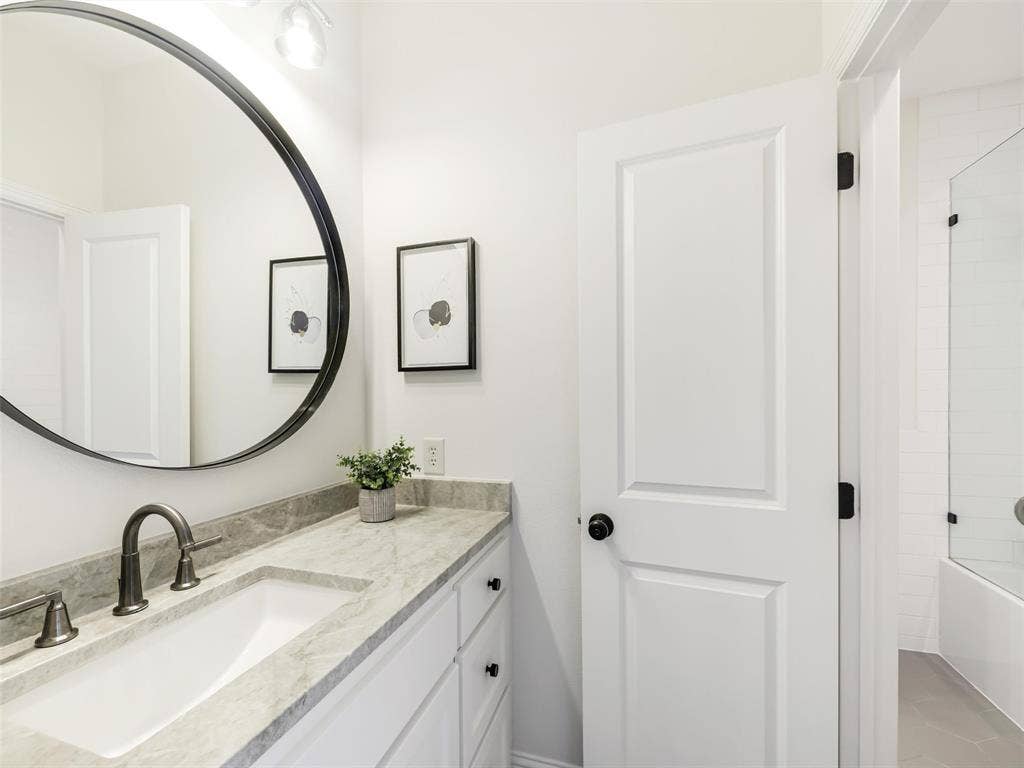 12313 Winding Hollow Lane, Frisco, TX 75033 Bathrooms are finished with a sophisticated selection of marble, quartzite, designer fixtures, and upscale equipment, continuing the elevated design aesthetic from one space to the next. Jack & Jill Vanity's: Taj Majal Quartzite