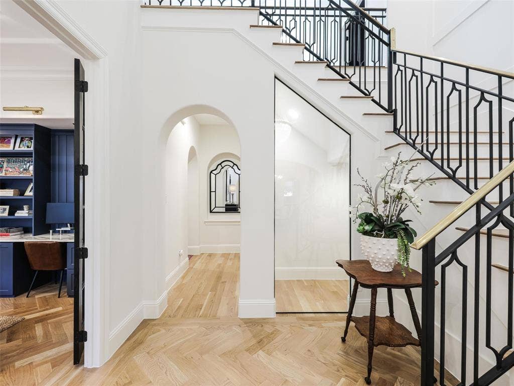 12313 Winding Hollow Lane, Frisco, TX 75033 Second Floor 1,801 sqft: Front Door to home, not Street: Black Iron Door w 3 Glass Panels with Brass Deadbolt (2023). Throughout the residence, extensive custom cabinetry and built-ins completed in 2023 add both beauty and practical storage. The upgraded staircase and luxury hardware further reinforce the attention to detail found throughout the home.