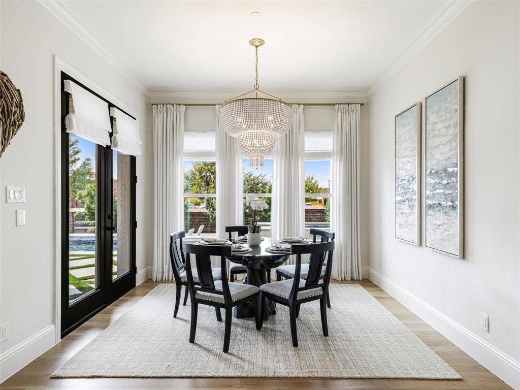 12313 Winding Hollow Lane, Frisco, TX 75033 Visual Comfort Aerin Jacqueline Two Tier Chandelier in hand rubbed antique brass with white beads.