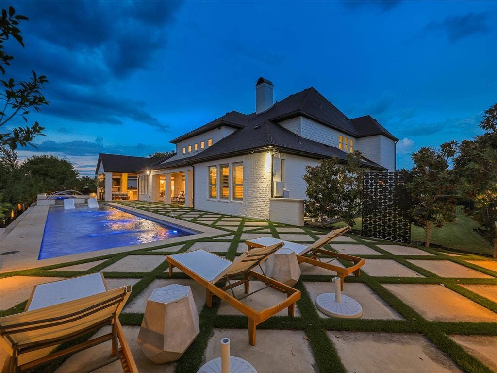 12313 Winding Hollow Lane, Frisco, TX 75033 While the interior is impressive, the outdoor living environment elevates this Newman Village home to another level. Designed as a private resort, the backyard centers around a custom heated pool completed in 2023. The pool is equipped with two Speck X commercial-grade swim jets, allowing for an enhanced swimming experience without leaving home. Eight deck jets add movement and visual interest, while the tanning ledge creates a relaxing space for enjoying warm Texas afternoons. Polaris equipment completes the thoughtfully designed pool system.The pool area also includes three chaise lounges, two side tables, two umbrella stands, and two Ledge Lounger chairs, creating multiple spaces for relaxing poolside. Whether enjoying a quiet afternoon in the sun or entertaining friends and family, the backyard was designed to accommodate both intimate gatherings and larger celebrations. Attached to the pool is an impressive custom spa completed in 2023. SIDE YARD GRASS. Plenty of ROOM!!!!