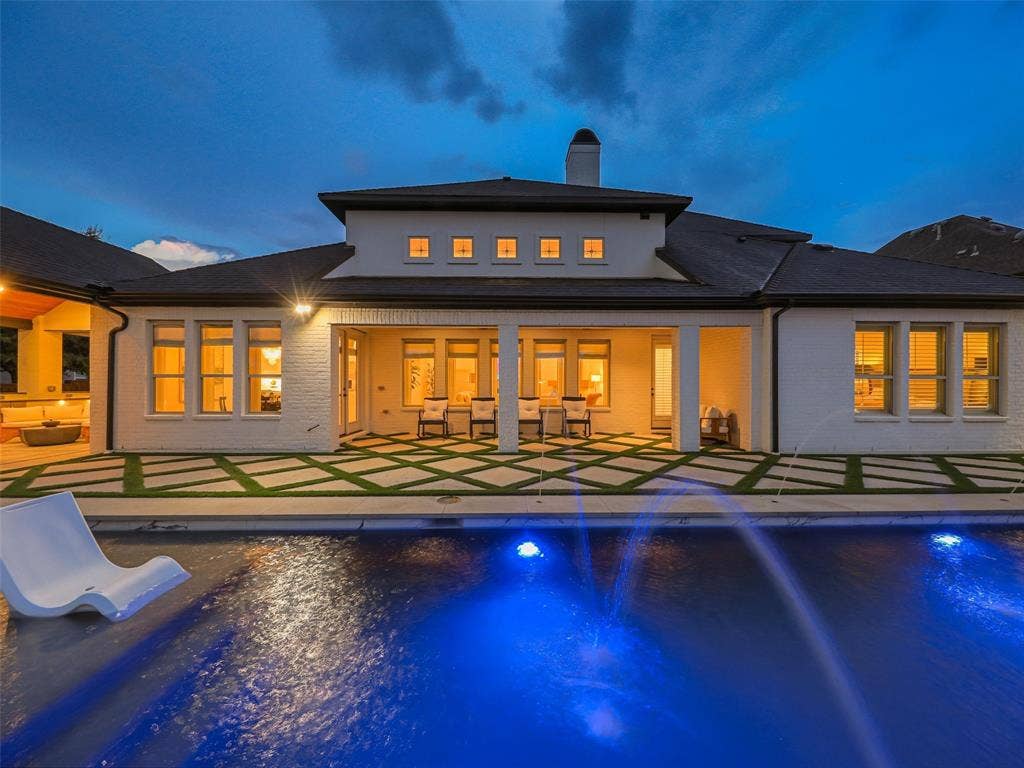 12313 Winding Hollow Lane, Frisco, TX 75033 While the interior is impressive, the outdoor living environment elevates this Newman Village home to another level. Designed as a private resort, the backyard centers around a custom heated pool completed in 2023. The pool is equipped with two Speck X commercial-grade swim jets, allowing for an enhanced swimming experience without leaving home. Eight deck jets add movement and visual interest, while the tanning ledge creates a relaxing space for enjoying warm Texas afternoons. Polaris equipment completes the thoughtfully designed pool system.The pool area also includes three chaise lounges, two side tables, two umbrella stands, and two Ledge Lounger chairs, creating multiple spaces for relaxing poolside. Whether enjoying a quiet afternoon in the sun or entertaining friends and family, the backyard was designed to accommodate both intimate gatherings and larger celebrations. Attached to the pool is an impressive custom spa completed in 2023. Designed to accommodate up to 18 people and featuring 18 jets.