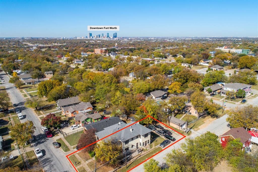 Aerial perspective highlighting the property's location within a tree-lined neighborhood