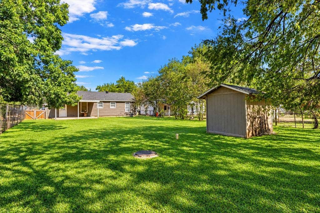 905 S Tyler, McGregor, TX 76657 Yard enhanced by AI