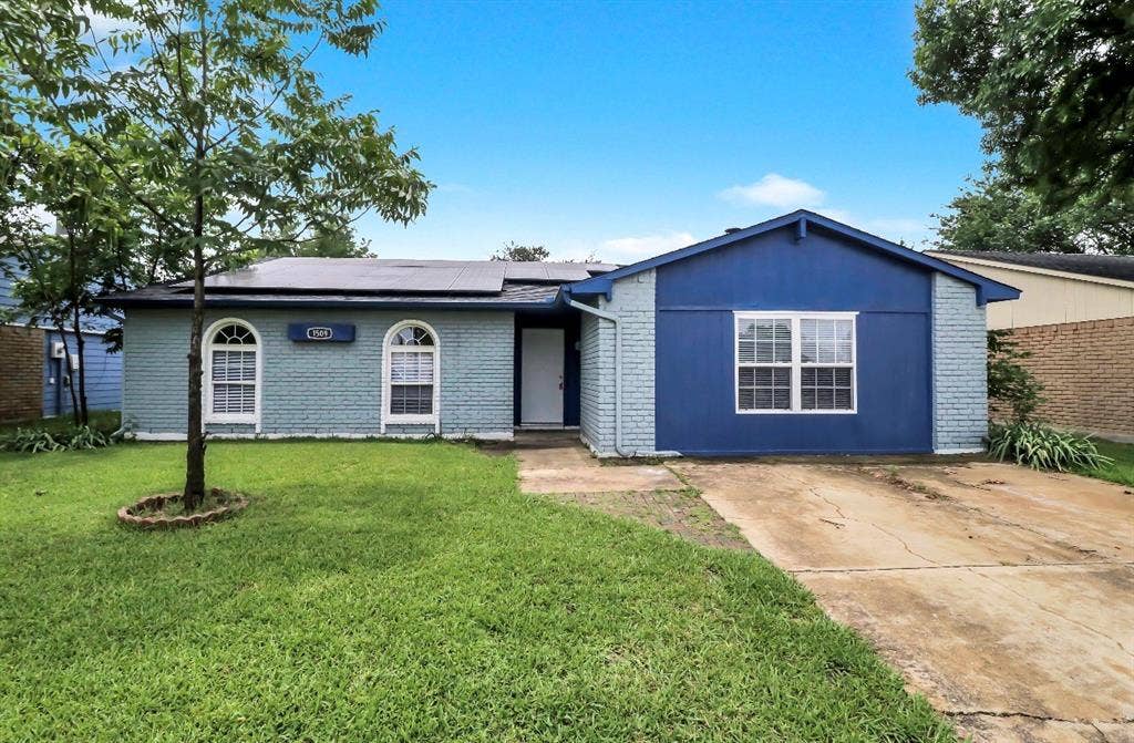 1509 California Trail, Grand Prairie, TX 75052 Brick exterior with blue siding accents
