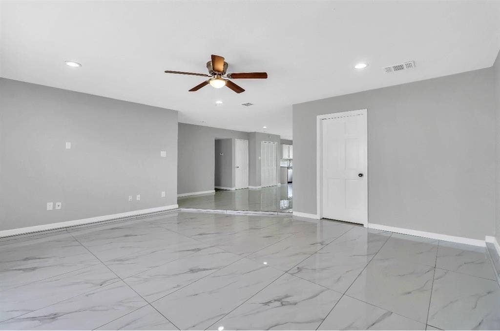 1509 California Trail, Grand Prairie, TX 75052 Spacious interior dining area room featuring large format tile flooring, light gray wall paint, recessed lighting, a ceiling fan, and white trim throughout
