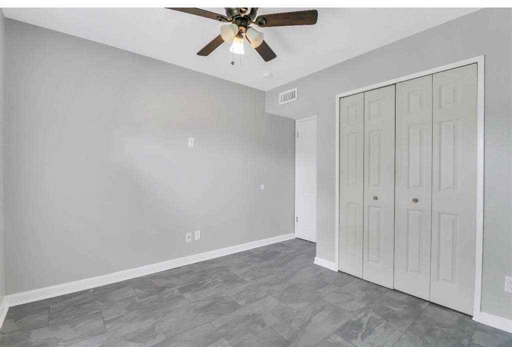 1509 California Trail, Grand Prairie, TX 75052 Room featuring grey walls, contemporary tile flooring, and a ceiling fan