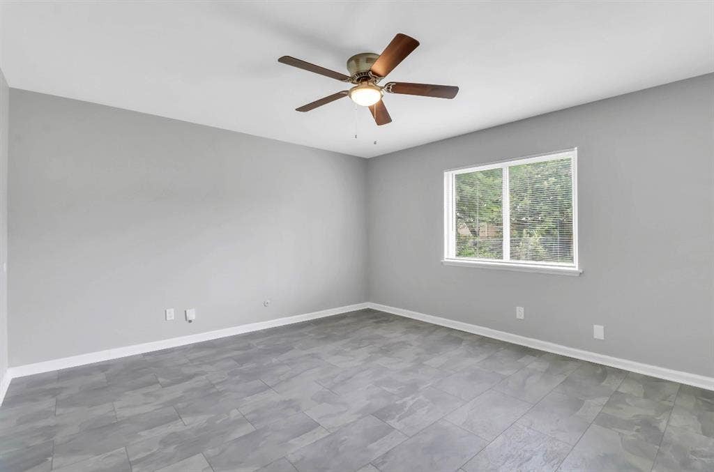 1509 California Trail, Grand Prairie, TX 75052 Neutral gray walls complementing gray tile flooring