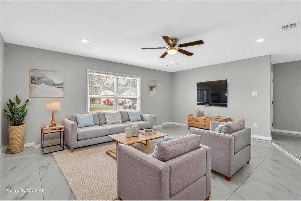 1509 California Trail, Grand Prairie, TX 75052 Living area featuring light gray walls, large window, ceiling fan with light fixture, recessed lighting, and large format tile flooring