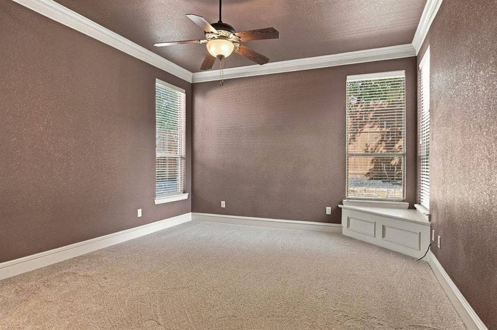 7004 Cherrybark Lane, North Richland Hills, TX 76182 Crown molding, ceiling fan, carpeting, multiple windows, built-in window bench
