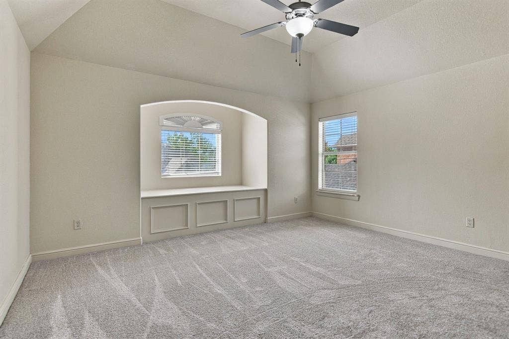 7004 Cherrybark Lane, North Richland Hills, TX 76182 Vaulted ceiling with a ceiling fan