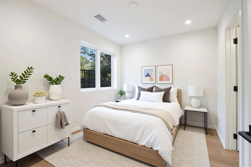 4811 Denton Drive, #201, Dallas, TX 75219 Recessed lighting illuminates this bright room with light wood-finish flooring