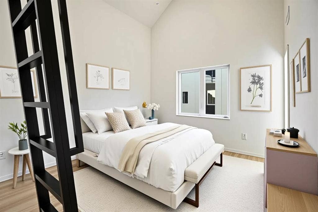 4811 Denton Drive, #201, Dallas, TX 75219 Vaulted ceiling with light-toned walls, wood-finish flooring, and a large window