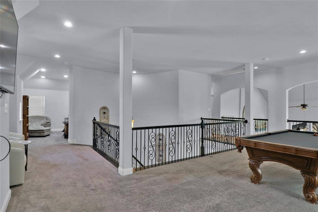 Room to left is a bonus room. Used as a second home office, it could be a gaming area, quiet reading space or workout space.