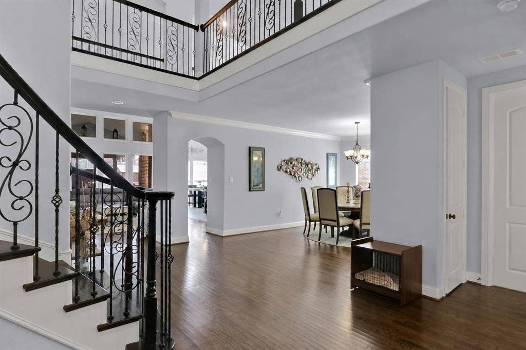 View from the entry. Home office is to the left. Dining ahead, followed by the kitchen and living room.