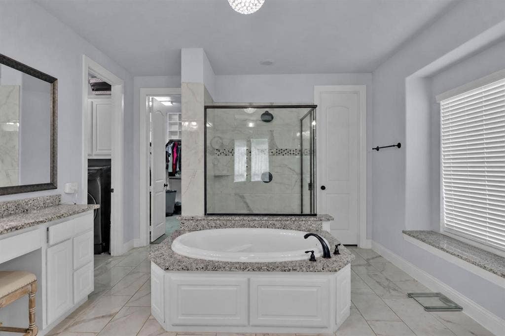 Garden tub with oversized separate shower.