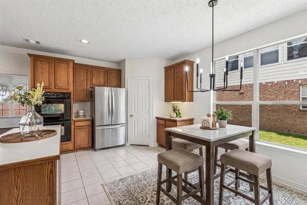 8121 Skyridge Drive, Plano, TX 75025 Spacious kitchen offers abundant cabinetry and workspace, plus gas already plumbed for future cooktop flexibility. *Virtually Staged*