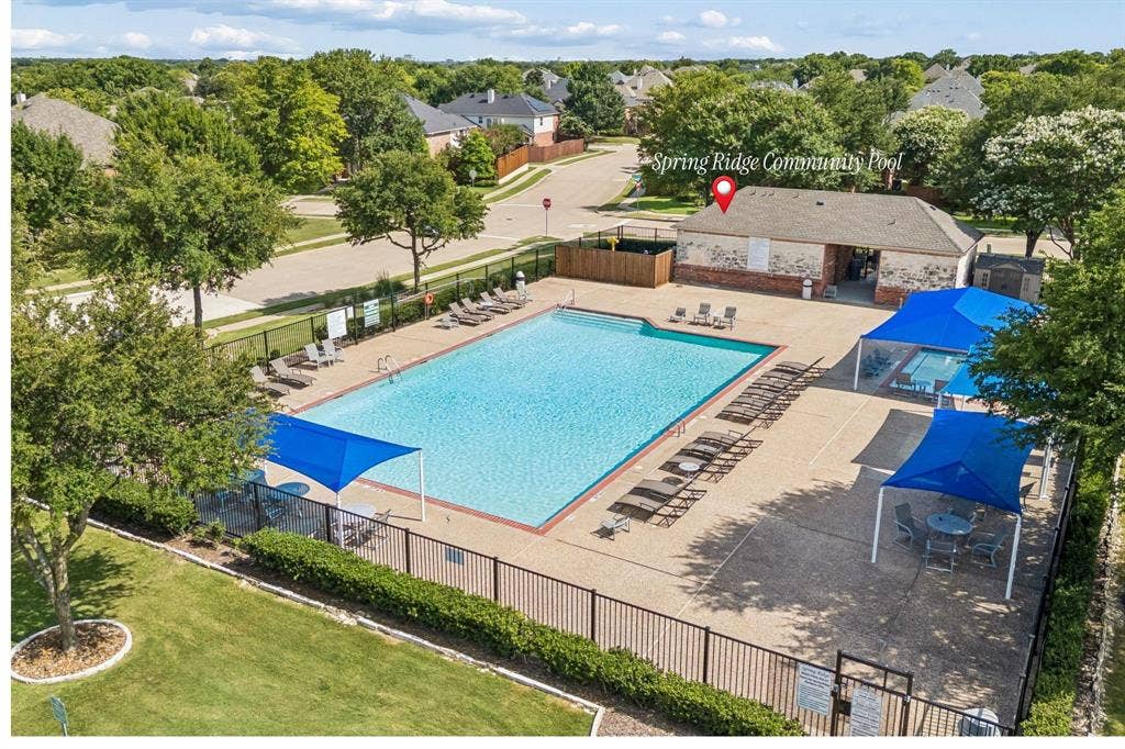 8121 Skyridge Drive, Plano, TX 75025 Spring Ridge community pool is located just one block from the home for convenient neighborhood recreation.