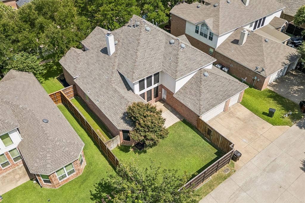 8121 Skyridge Drive, Plano, TX 75025 Aerial view highlights the home's spacious lot, established trees and 3-Car Garage.