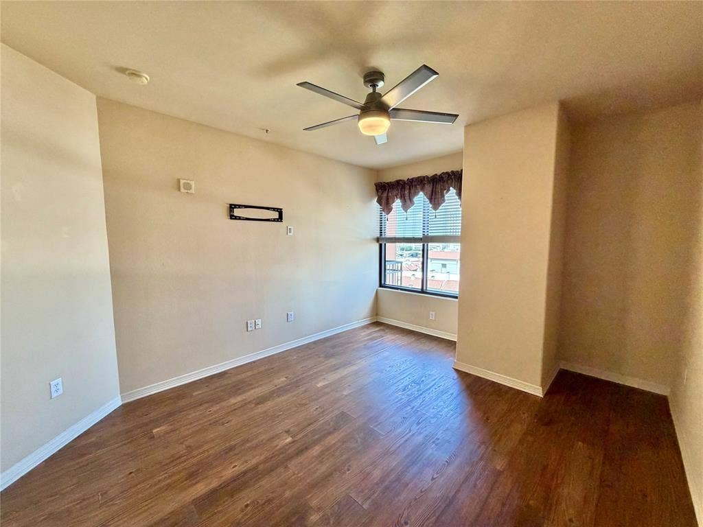 330 Las Colinas Boulevard E, #1006, Irving, TX 75039 Wood-finish flooring throughout, complemented by a ceiling fan with integrated lighting