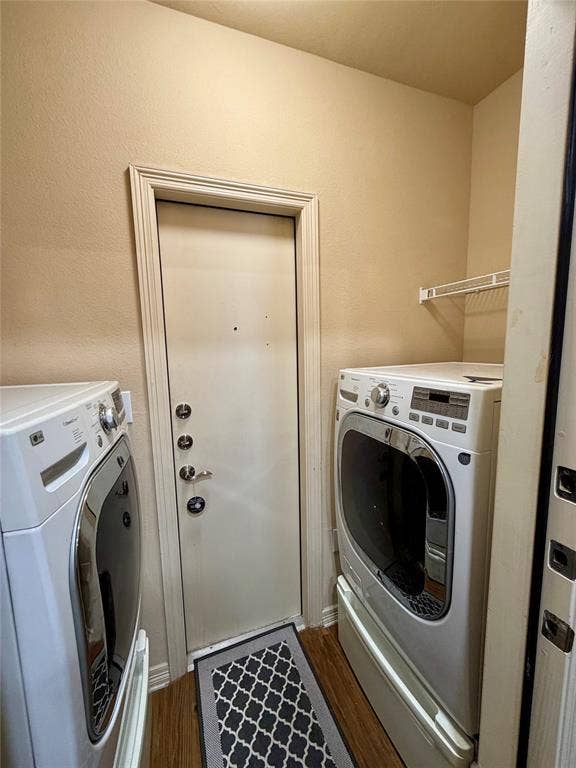 330 Las Colinas Boulevard E, #1006, Irving, TX 75039 Laundry area featuring wood-finish flooring, a white metal wire shelf, and a white door with multiple locks