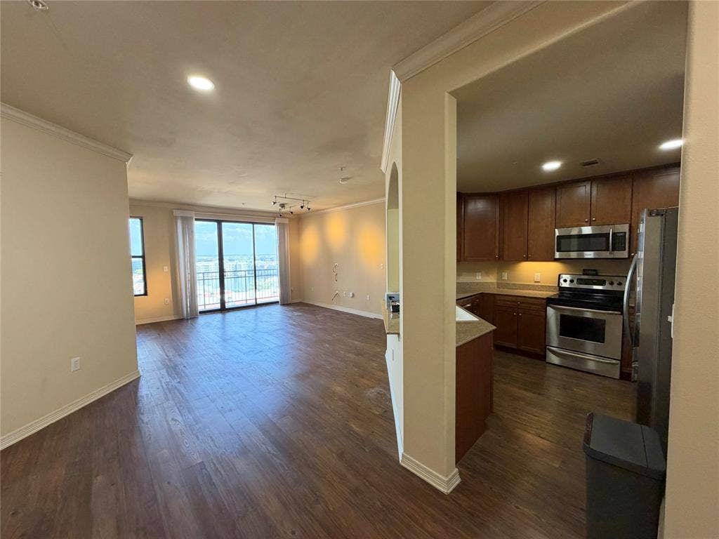 330 Las Colinas Boulevard E, #1006, Irving, TX 75039 Wood-finish flooring, recessed lighting, and crown molding