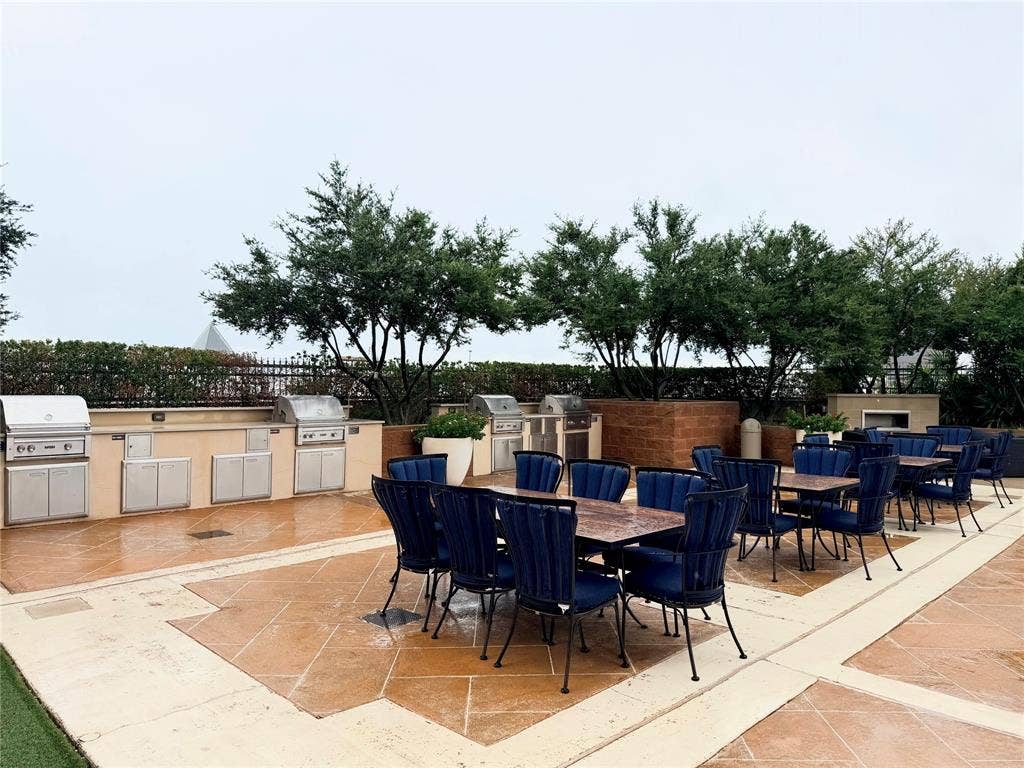 330 Las Colinas Boulevard E, #1006, Irving, TX 75039 Outdoor kitchen area featuring multiple stainless steel grills, extensive counter space, and built-in cabinetry