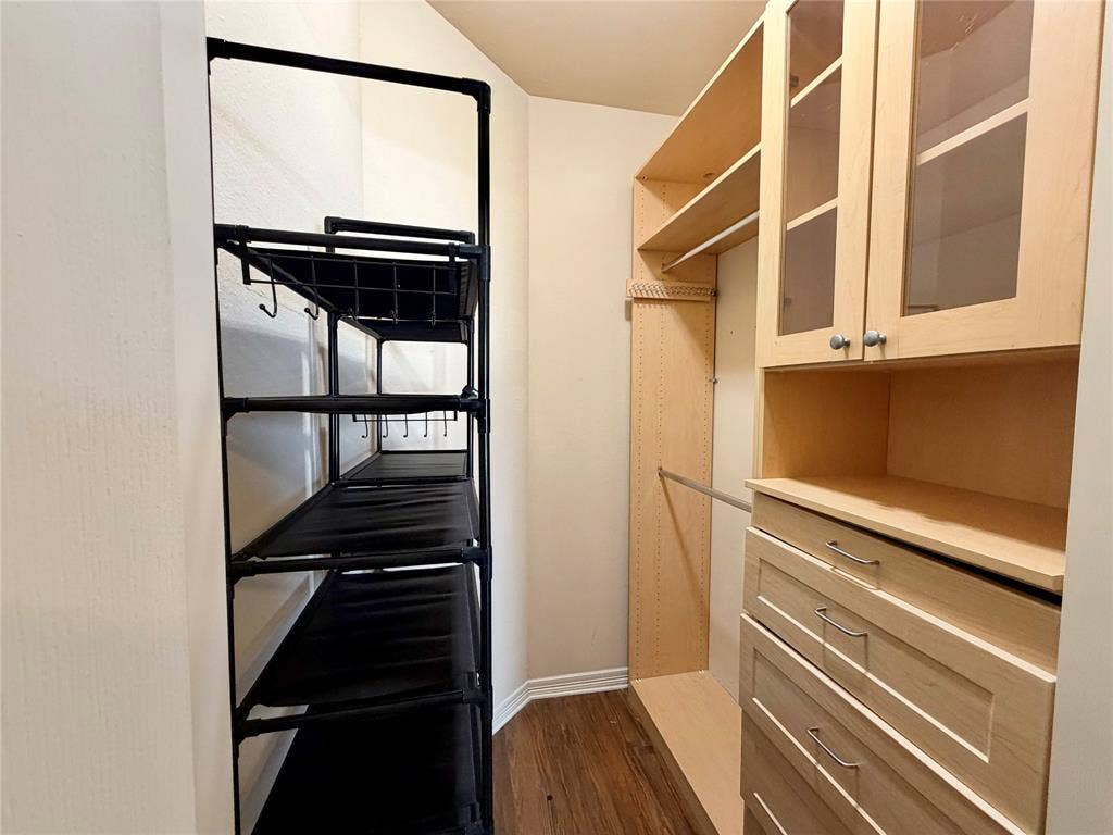 330 Las Colinas Boulevard E, #1006, Irving, TX 75039 Built-in closet system featuring multiple shelves, drawers, and hanging rods