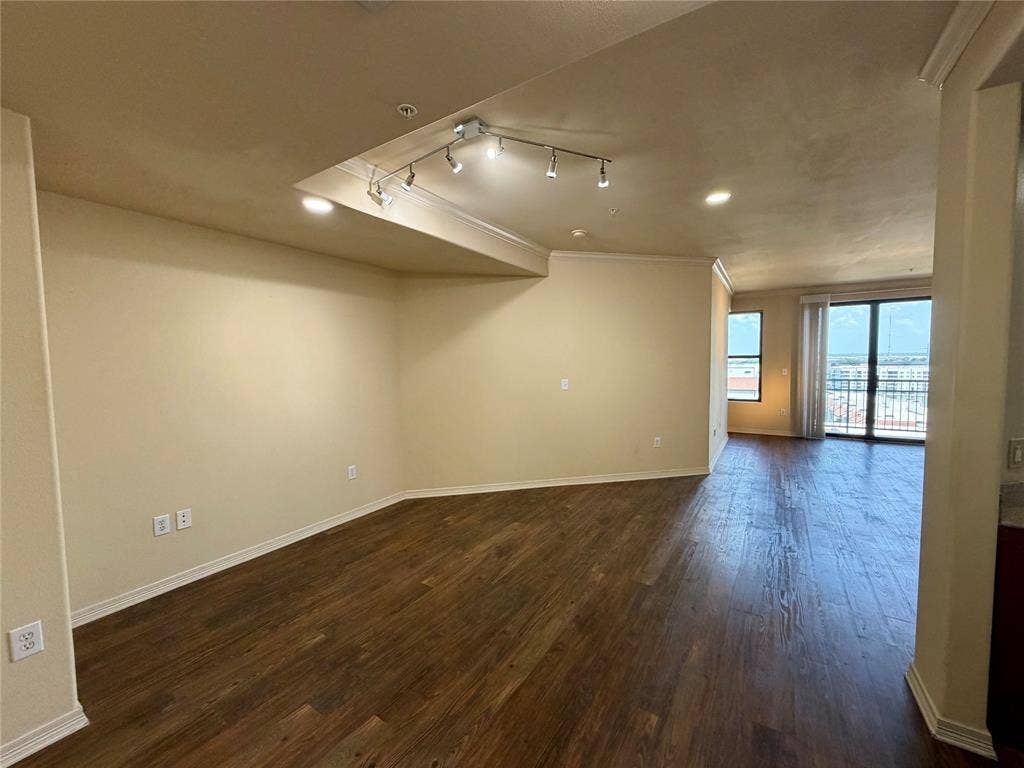 330 Las Colinas Boulevard E, #1006, Irving, TX 75039 Expansive open-concept living area featuring wood-finish flooring, recessed lighting, and crown molding