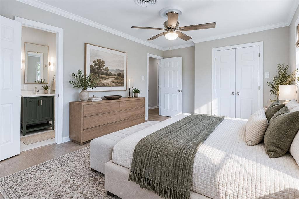 1312 E Mitchell Street, Arlington, TX 76010 Wood-finish flooring, ceiling fan with integrated lighting, dual bifold closet doors, and crown molding