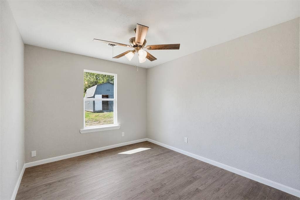 1312 E Mitchell Street, Arlington, TX 76010 Wood-finish flooring with white trim