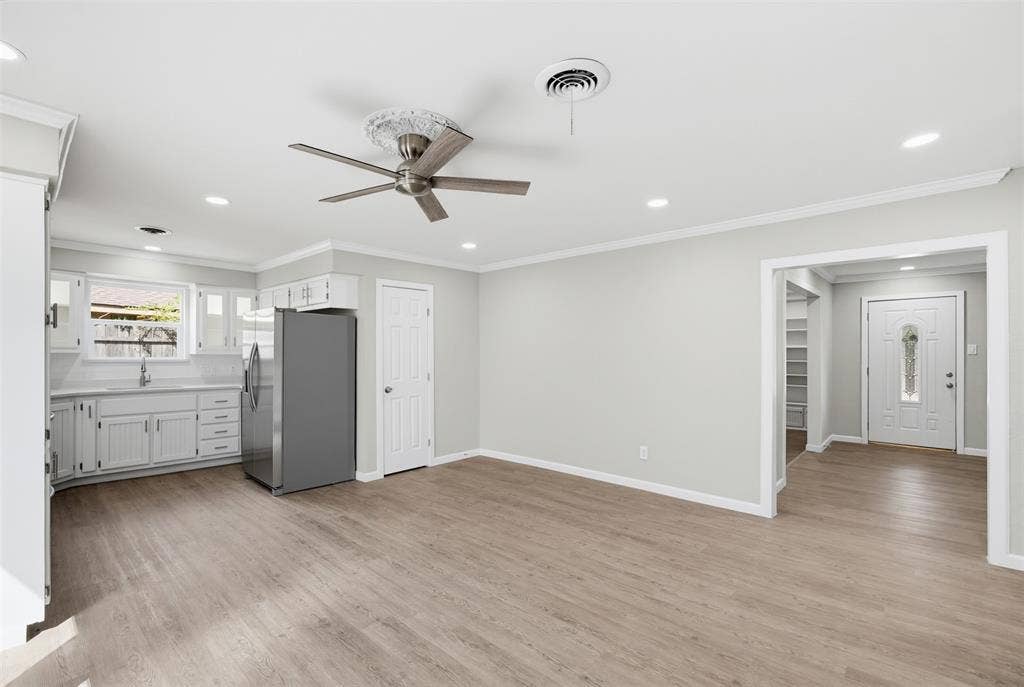 1312 E Mitchell Street, Arlington, TX 76010 Open-concept living area with wood-finish flooring, recessed lighting, and a ceiling fan